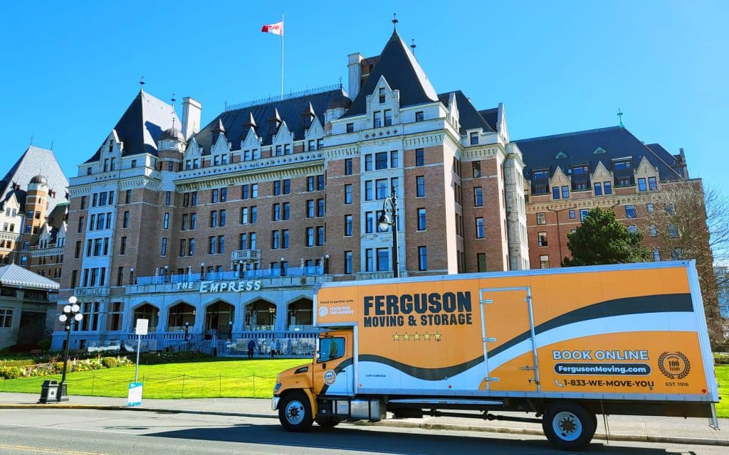 Ferguson Moving truck in front of a historic building, captured by movers in Victoria.