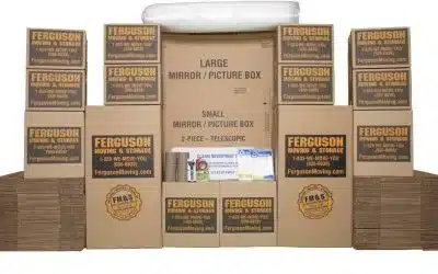 Assortment of cardboard moving boxes in various sizes stacked neatly.