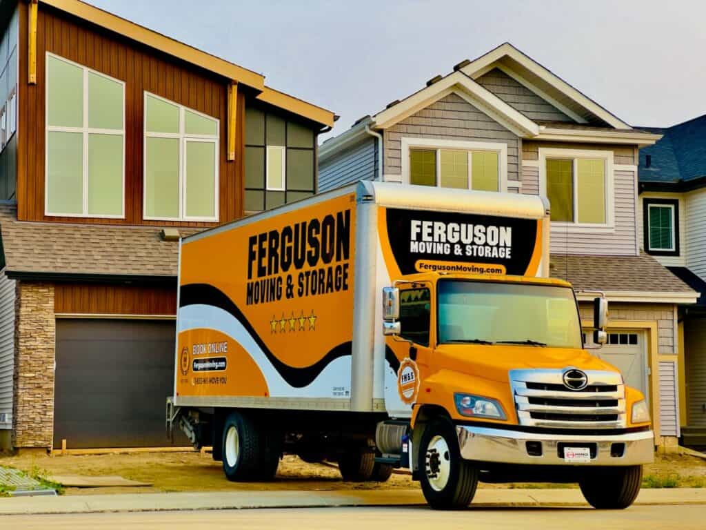 Moving truck parked in front of a house.