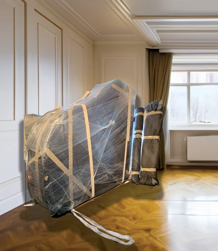 Wrapped piano placed on the floor of a home, ready for a piano move.