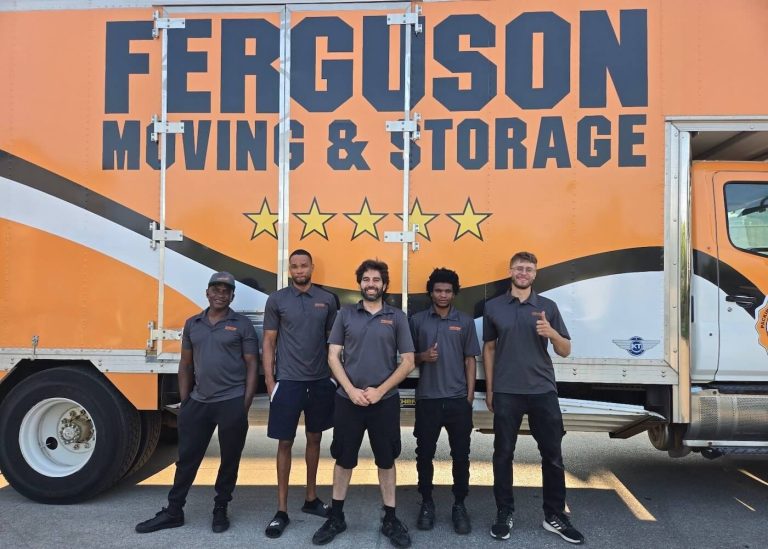 Local GTA Toronto movers posing in front of a moving truck.